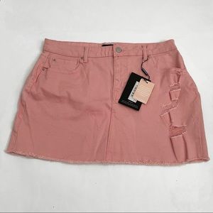 Baby pink distressed denim skirt